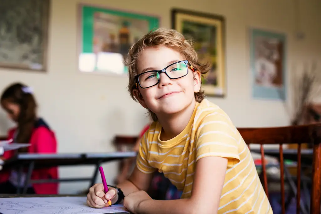 Child with autism developing communication and learning skills in a classroom