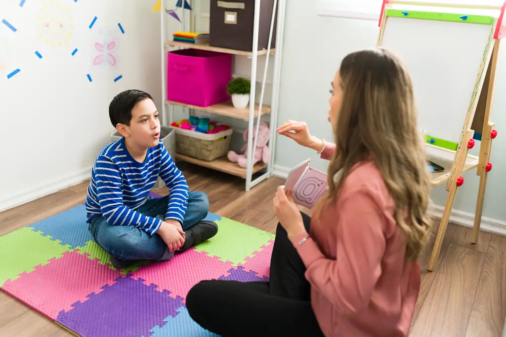 Speech therapist working with a child to improve speech and communication skills