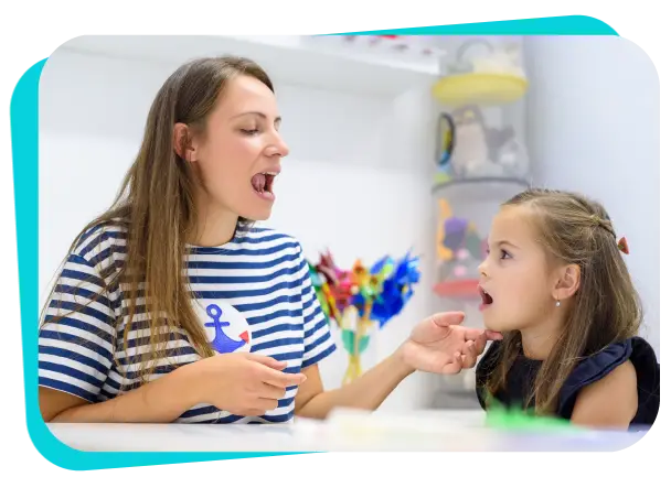 Speech therapist helping a child practice pronunciation during speech therapy session